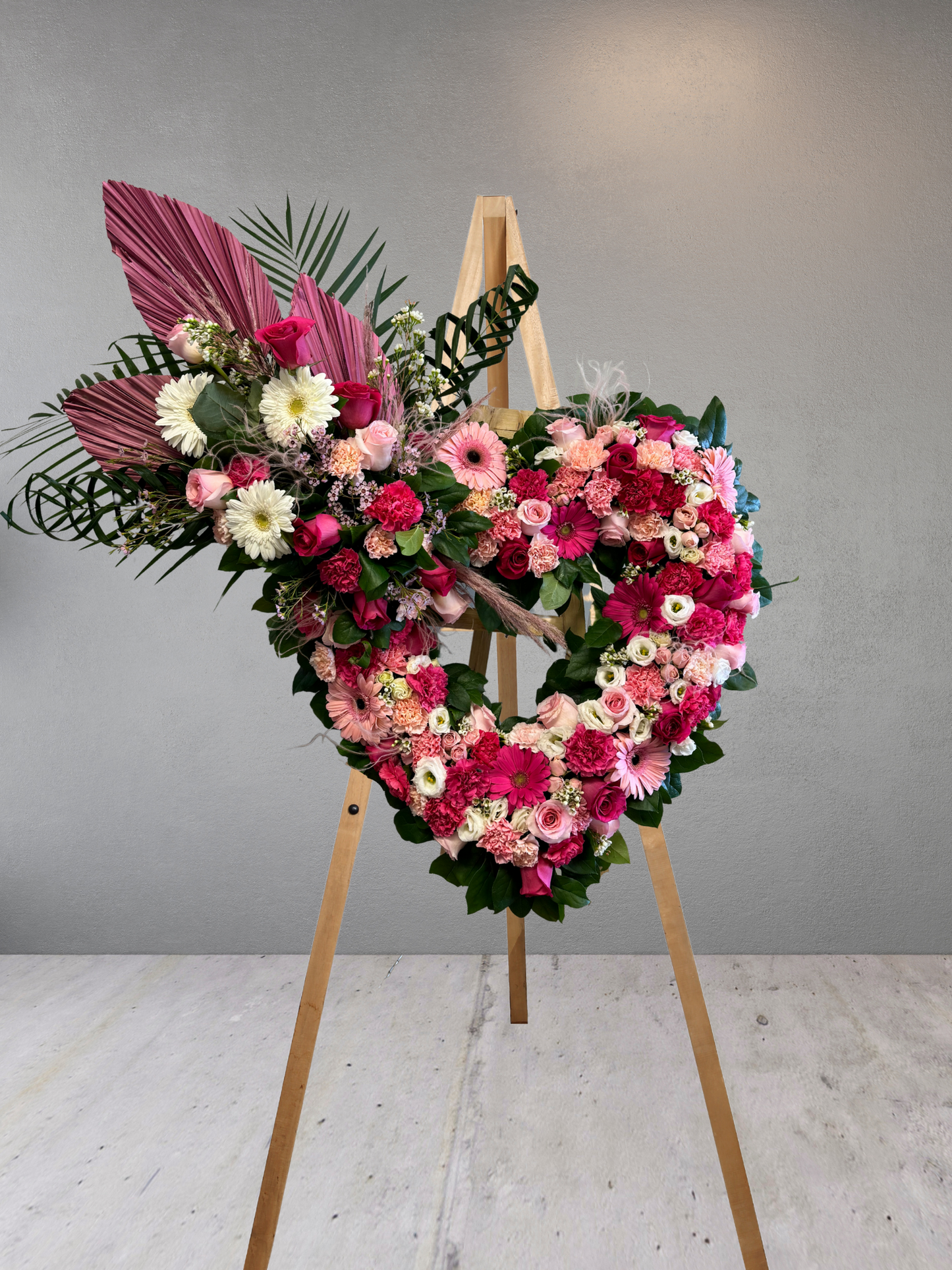 Mixed Pink Open Heart Funeral Wreath With Top Spray