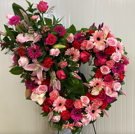 Mixed Pink Open Heart Wreath With Top Spray