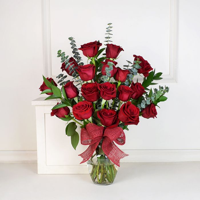 Red rose and eucalyptus vase arrangement